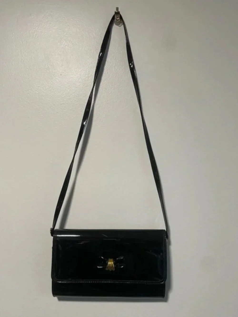 Rafy Black Patent Leather Crossbody Bag with Gold Bow Detail